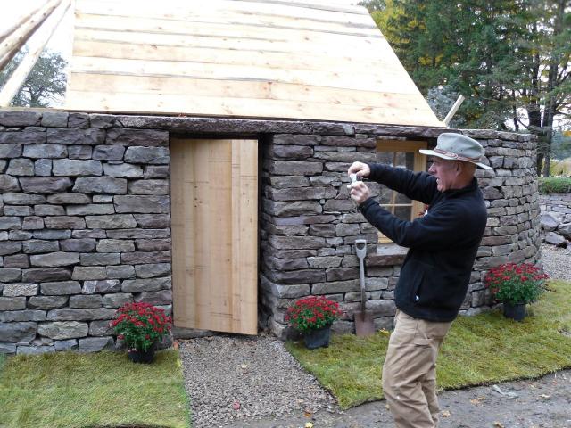 International stone restoration expert, Patrick McAfee takes one last picture of the blackhouse before he returns to Ireland